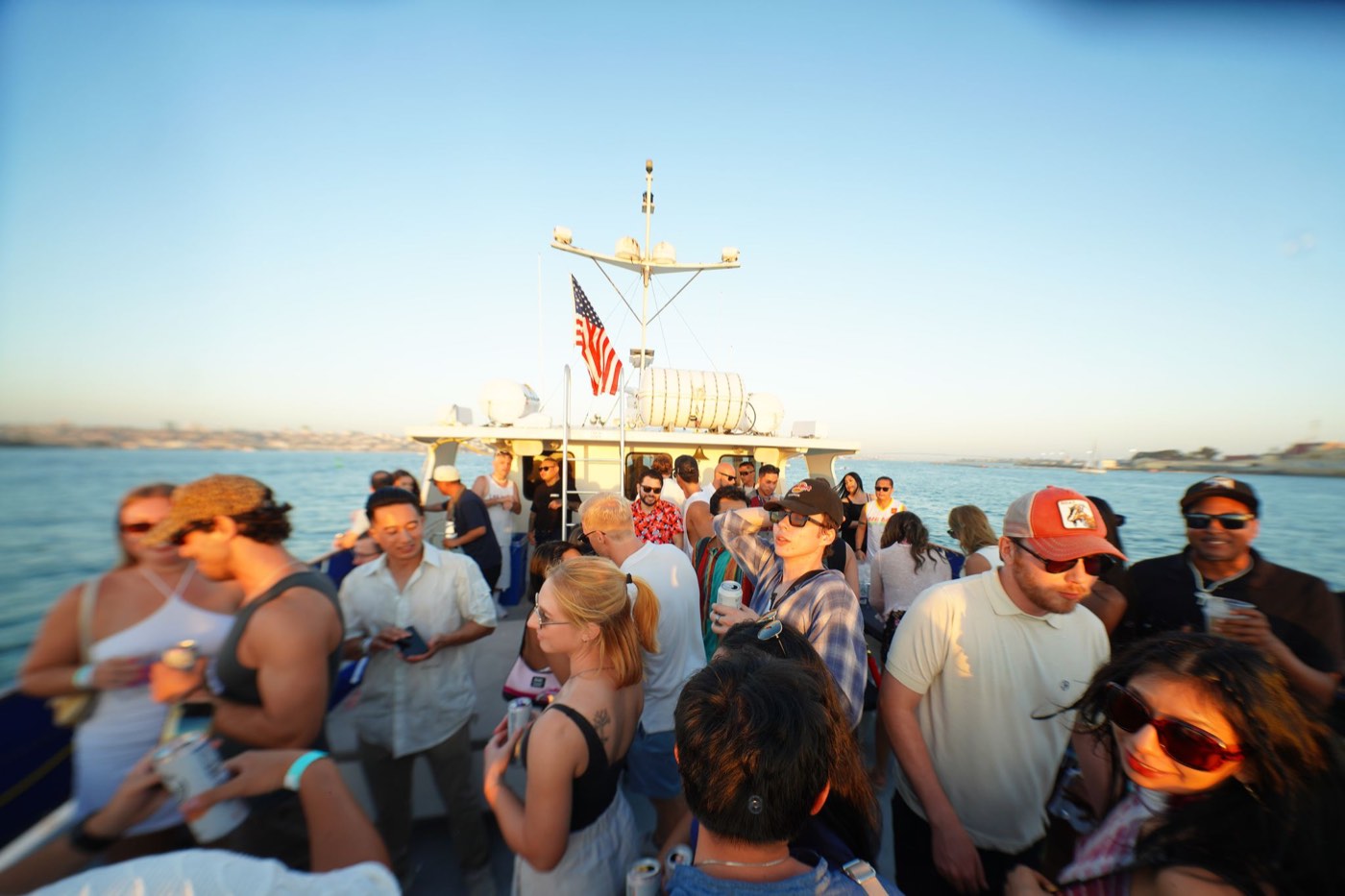 Crowd on the top deck of a boat on the water