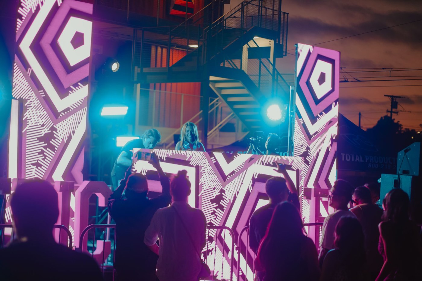 Lit LED panels behind the stage