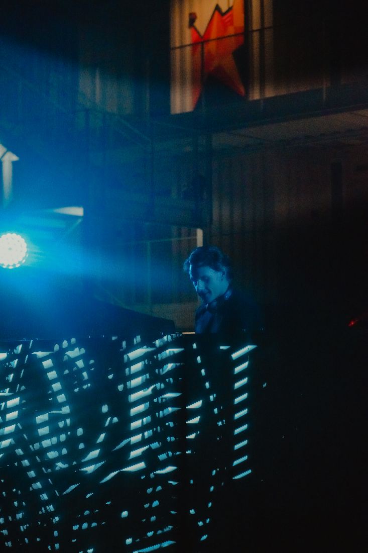 Blue light across the stage wall after dark
