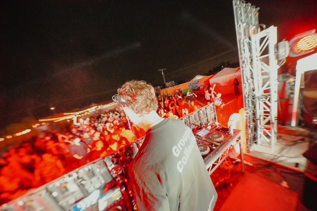 The booth in red with the rig lit behind it